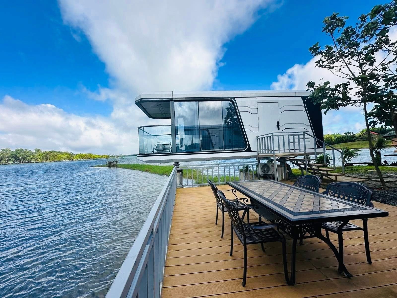 The Spacehouse — glass capsule over the lake