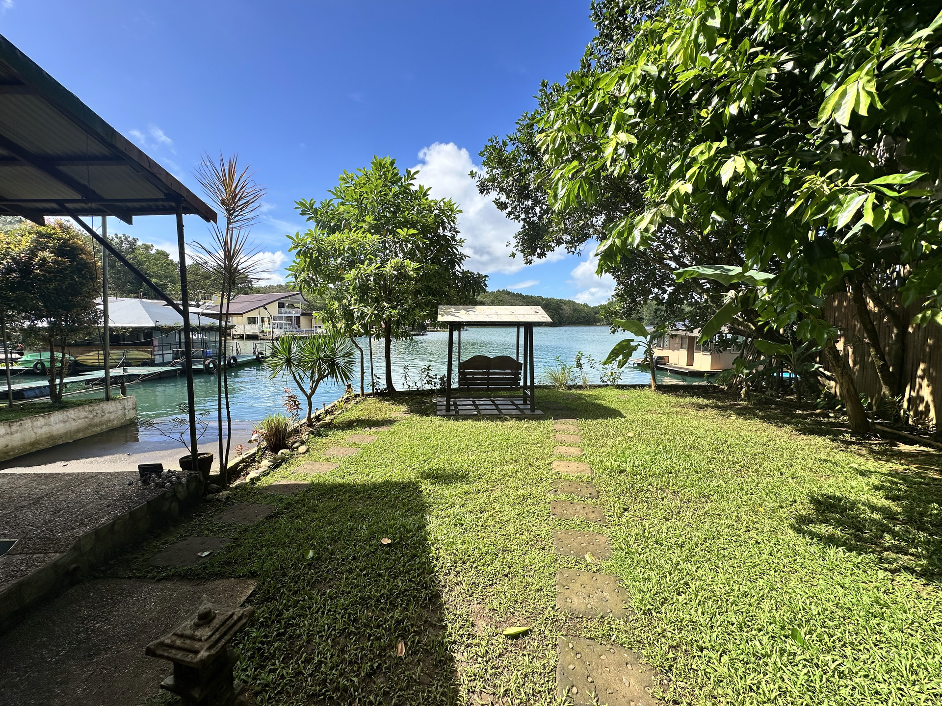 Yolly's Lake House — garden swing and lake